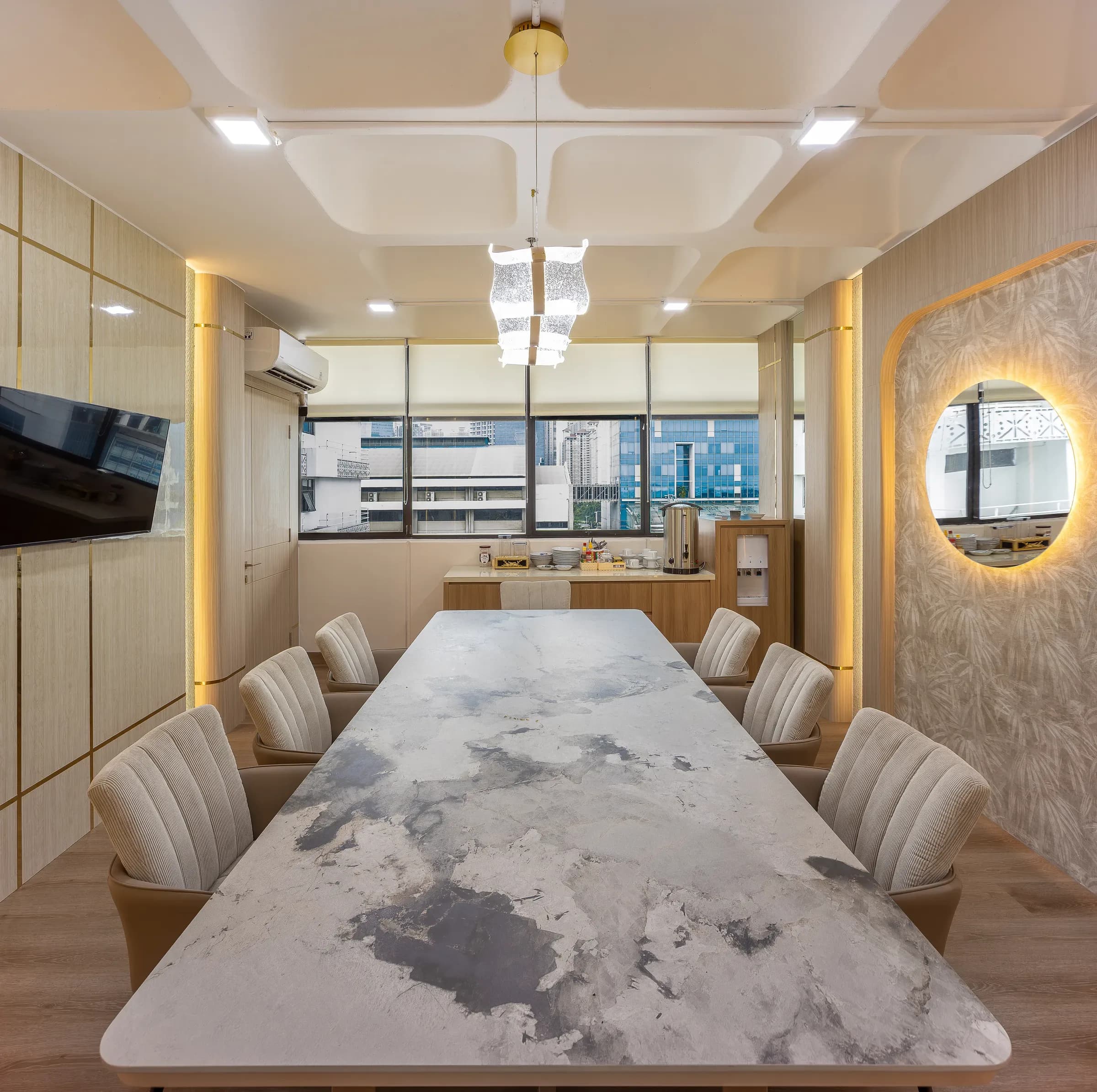 Meeting room with a marble table and upholstered chairs